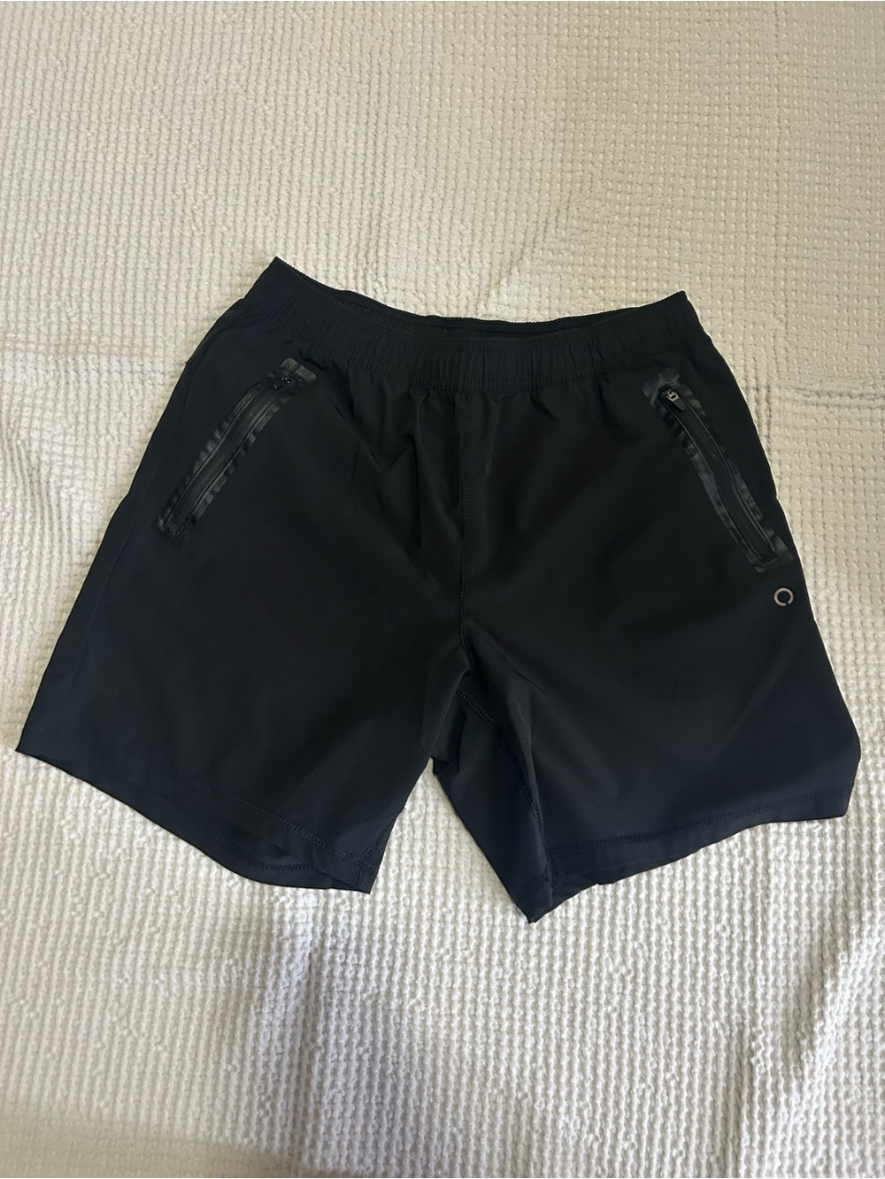 Running shorts with zip pockets
